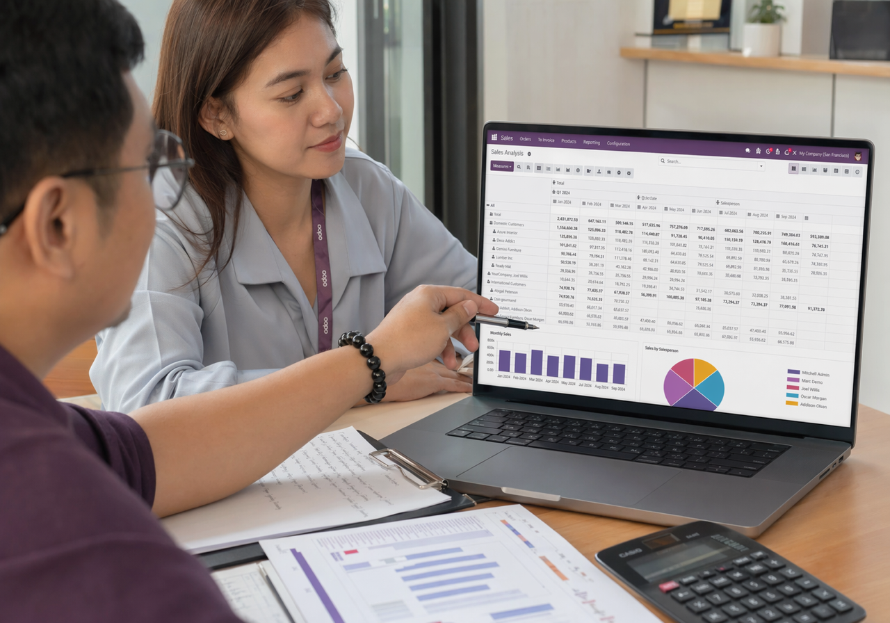 Filipino team reviewing Odoo reporting tables and dashboard charts for operational visibility